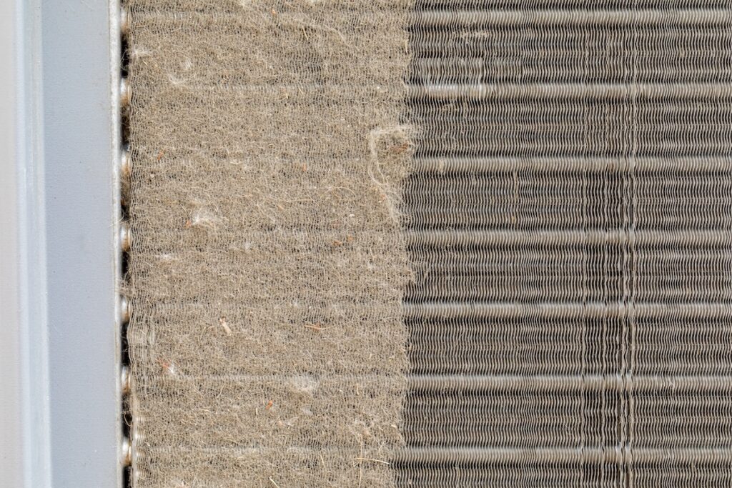dirty condenser coil on outdoor AC unit