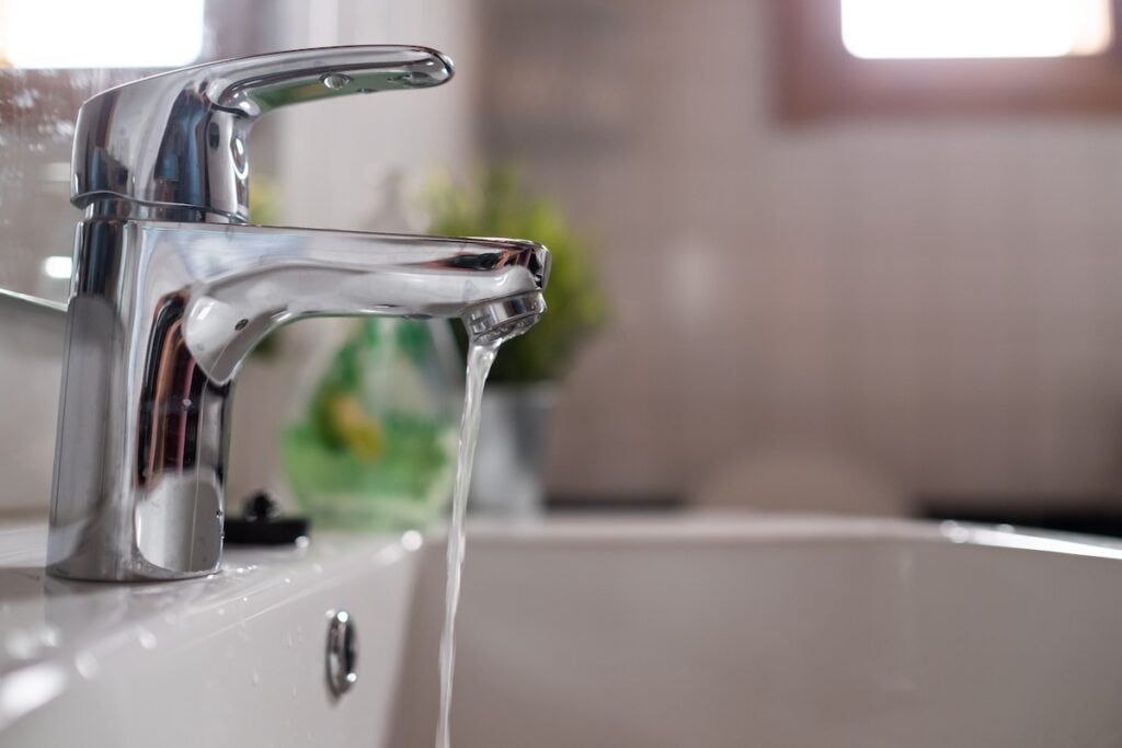 Open chrome faucet washbasin with low water pressure