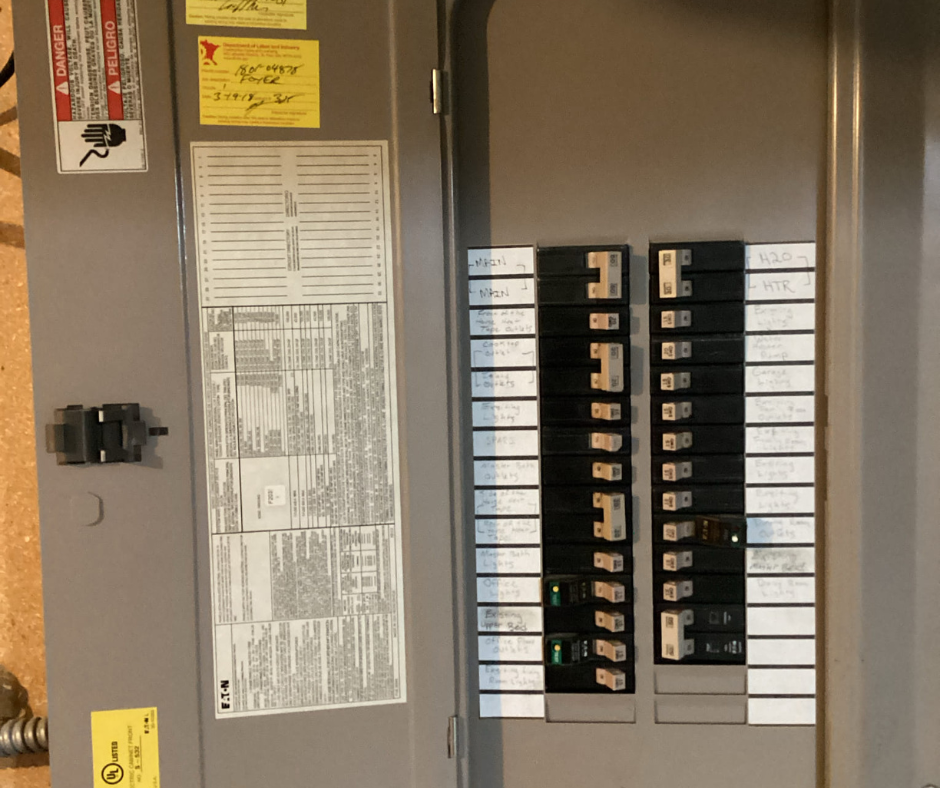 Electrician Near Me | Breaker Panel Inspection Electrician near me inspecting a home breaker panel in the Twin Cities.