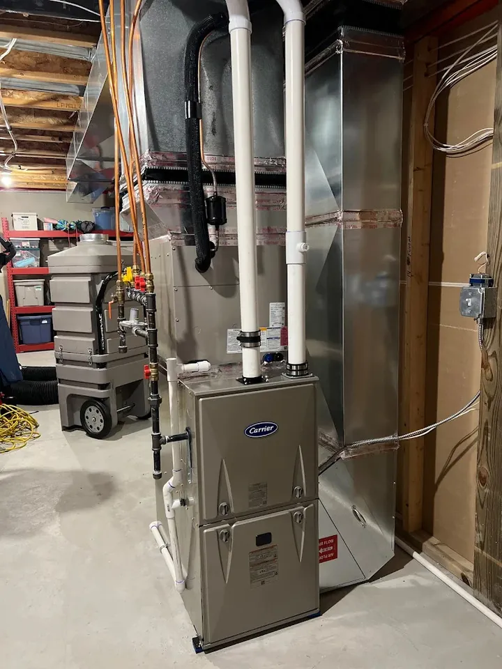 newly installed carrier furnace in a homeowner's basement