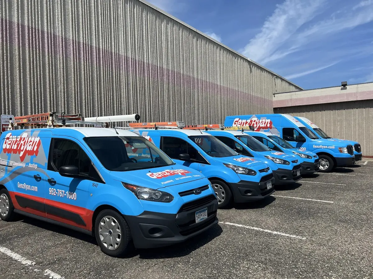 genz ryan vans lined up outside of their office in Burnsville, MN