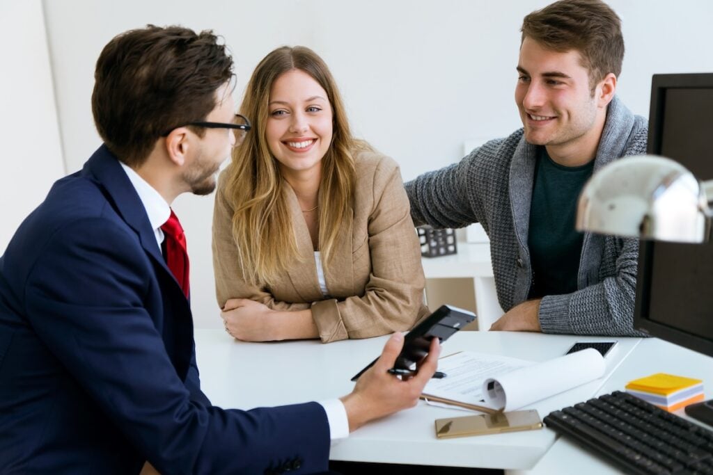 young couple meeting with banker