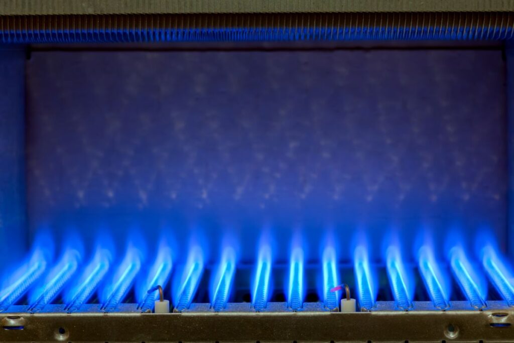 Burning gas in water heater furnace