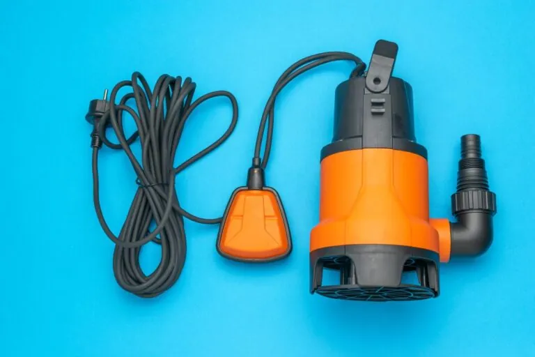 Orange Submersible Water Pump with Cord and Float Switch on Blue Background