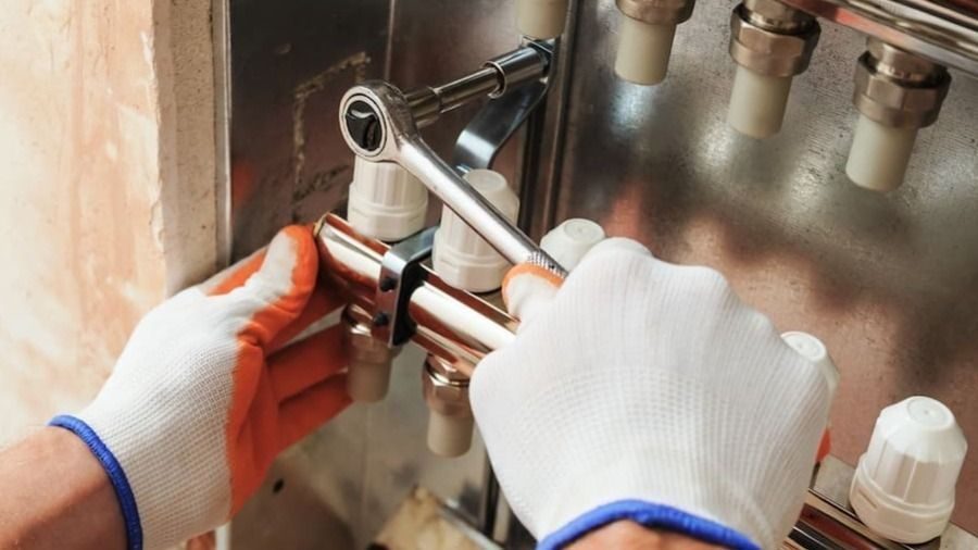 A technician repairing a heating system