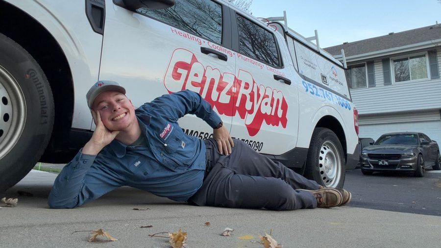 Genz-Ryan technician done with an install of a whole-home generator. Happy because they know the customer is safe.